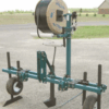 Drip tape applicator on a road