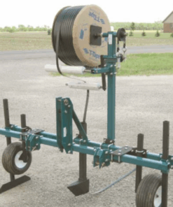 Drip tape applicator on a road