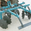 Leveling bar on 2 bar bedder attached to a tractor back